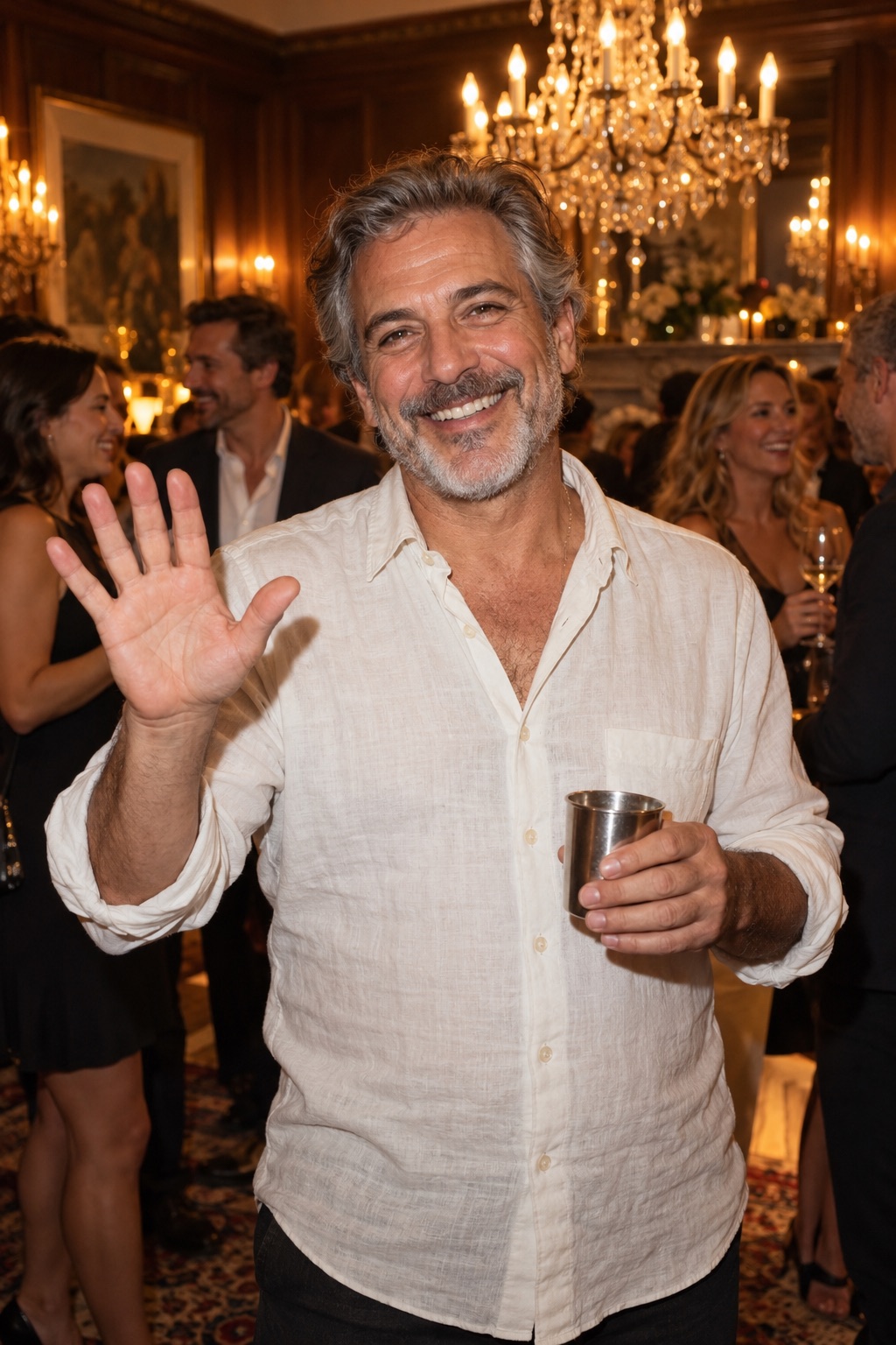 Original concept of an older adult man smiling and waving with a silver cup at a house party